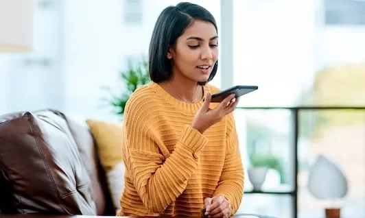 Woman Using Phone on Speaker