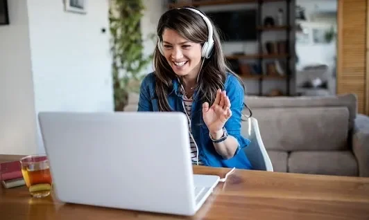 Woman Using Laptop for Video