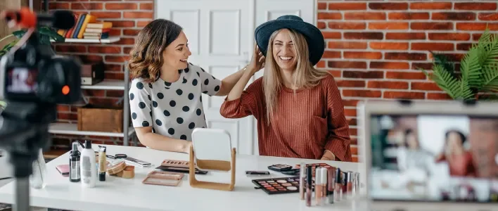 women_smiling_wearing_a_hat