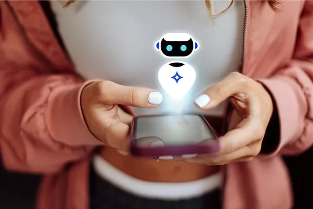 A person holding a smartphone with a glowing chatbot graphic above it.